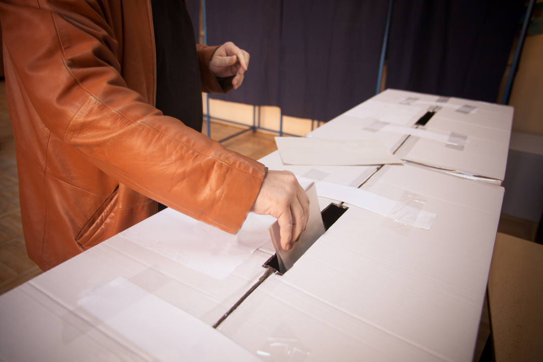 Person voting at polling station